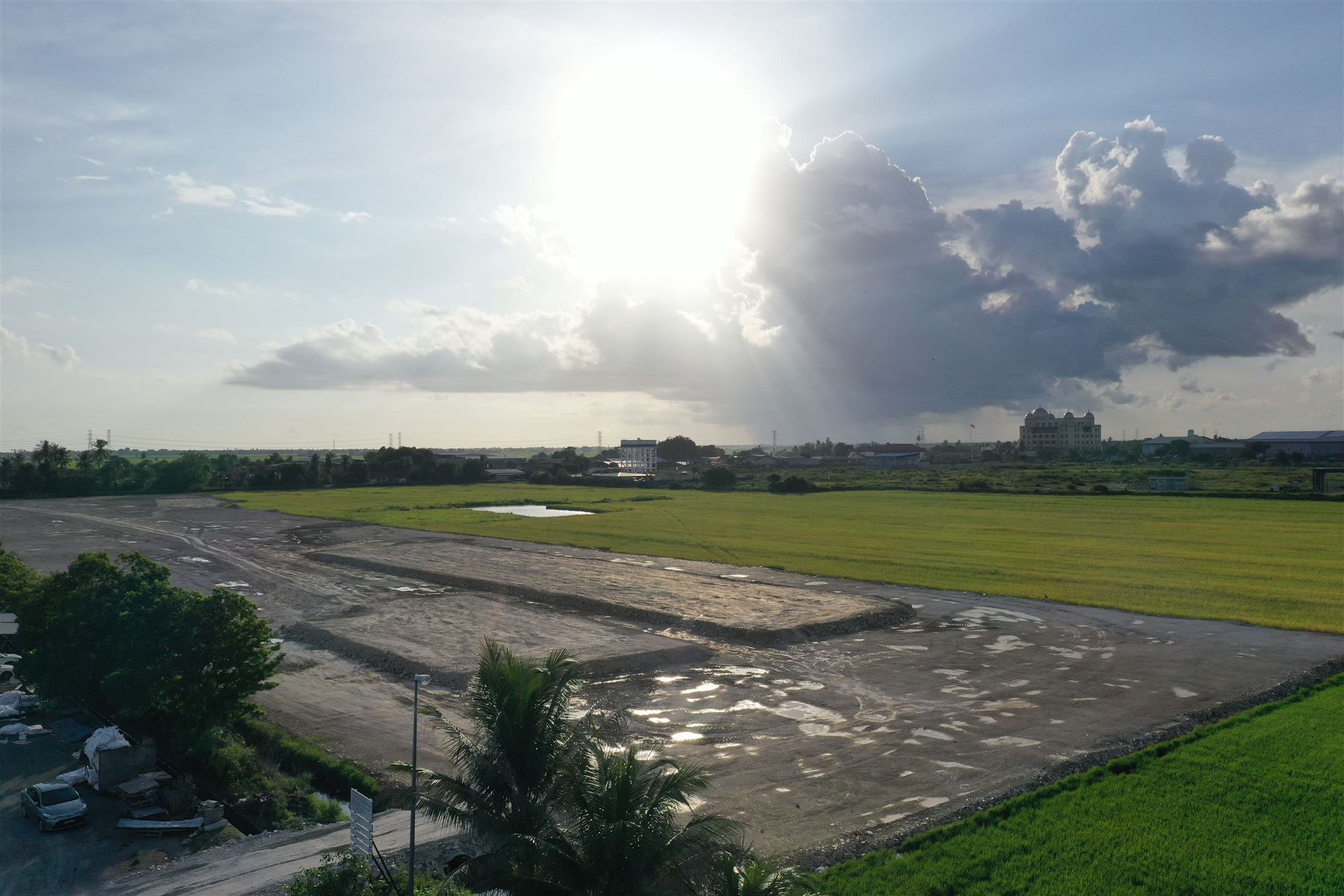 Ground-level view of Aman Sierra earthworks at golden hour